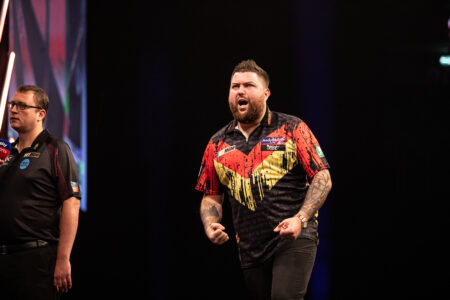 Michael Smith on stage at the 2024 Premier League Darts