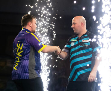 Luke Littler and Rob Cross on stage at the 2024 PDC World Darts Championship.
