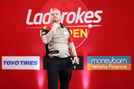 Dimitri Van den Bergh on stage at the 2024 UK Open
