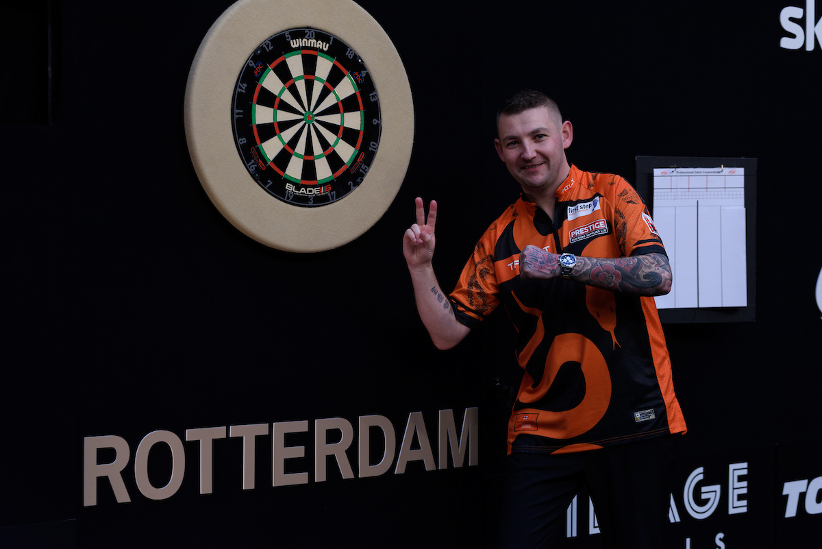 Nathan Aspinall celebrates his nightly win in Rotterdam in the 2024 Premier League Darts.