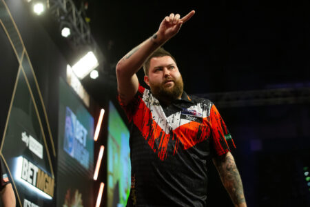 Michael Smith on stage during the 2024 Premier League Darts