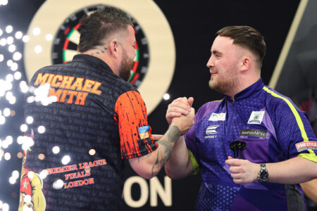 Luke Littler and Michael Smith on stage during the 2024 BetMGM Premier League Darts 