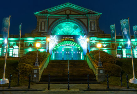 A photo of Alexandra Palace lit up in green ahead of the Paddy Power World Darts Championship. Credit: PDC