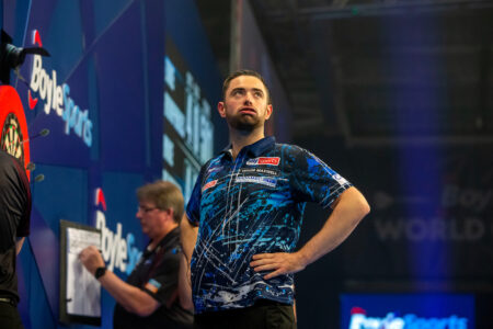Luke Humphries has his hands on his hips during the World Grand Prix Final.