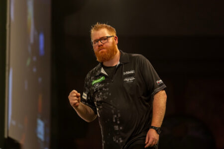 Matt Campbell celebrating on stage at the Paddy Power World Darts Championship.