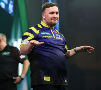 Luke Littler on stage during the 2026 Paddy Power World Darts Championship.