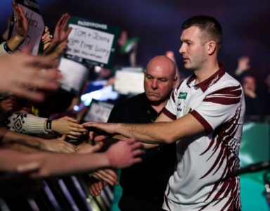 Madars Razma on the walk on area at the Paddy Power World Darts Championship.