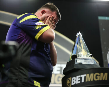Luke Littler reacts emotionally after winning the Premier League title at the O2 Arena