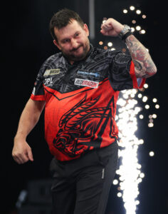 Jonny Clayton celebrates during the 2026 BetMGM Premier League Darts season after securing one of his four nightly victories.