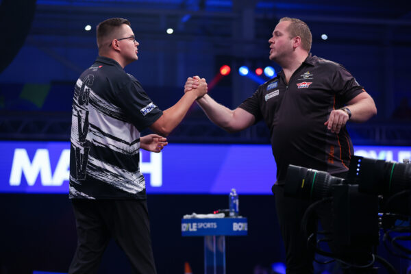 Luke Humphries and Gian Van Veen Progress as World Grand Prix Reaches Round Two