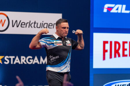Gerwyn Price celebrates on stage at the 2026 European Championship.