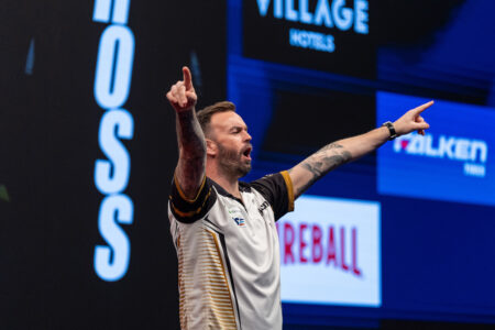 Ross Smith celebrates on stage at the 2026 European Championship.