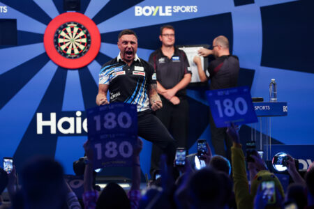 Gerwyn Price celebrates on stage at the 2026 World Grand Prix.