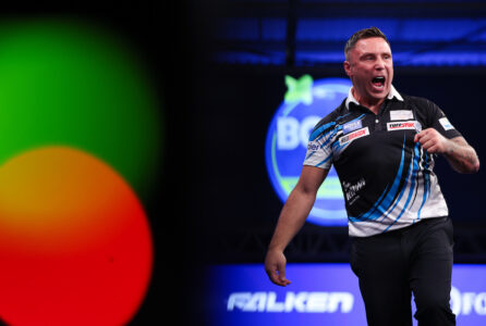 Gerwyn Price celebrates on stage during the 2026 World Grand Prix.